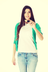 Young woman writing on copy space with pencil.