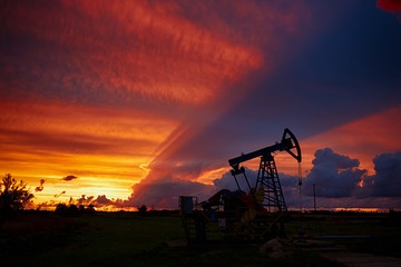 Oil derricks on a background of beautiful sunset