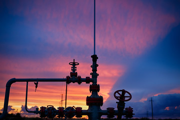 Oil derricks on a background of beautiful sunset
