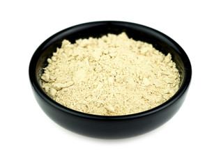 Kava root in bowl isolated on white