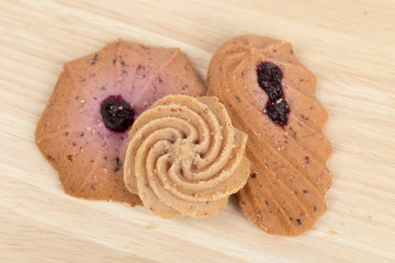 Cookies on wooden table background close up