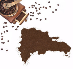 Coffee powder in the shape of Dominican Republic and a coffee mi