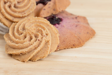 Cookies on wooden table background close up