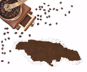 Coffee powder in the shape of Jamaica and a coffee mill.(series)