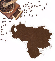 Coffee powder in the shape of Venezuela and a coffee mill.(serie