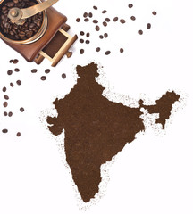 Coffee powder in the shape of India and a coffee mill.(series)