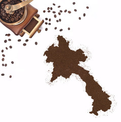 Coffee powder in the shape of Laos and a coffee mill.(series)