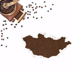 Coffee powder in the shape of Mongolia and a coffee mill.(series
