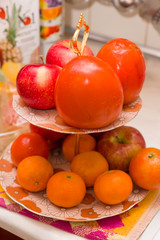 bright fruit lies on plates with a support