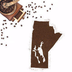 Coffee powder in the shape of Manitoba and a coffee mill.(series