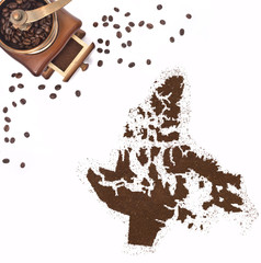 Coffee powder in the shape of Nunavut and a coffee mill.(series)