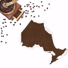 Coffee powder in the shape of Ontario and a coffee mill.(series)