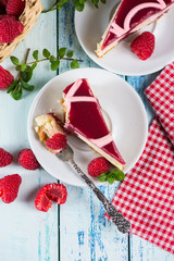 Raspberry cake with fresh fruits on rustic table