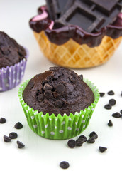 Close up of chocolate muffins on a white table