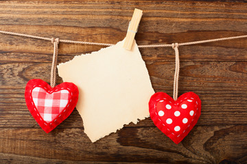 Valentines Vintage Handmade Hearts over Wooden Background.