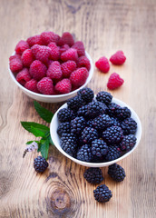 Bowls overflowing with summer berries 
