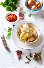 Ingredients for making  conchiglie pasta with spicy red pesto