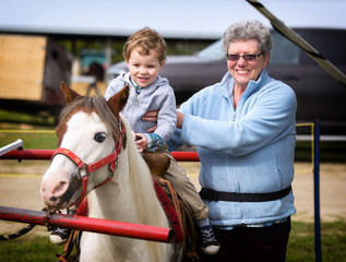 Boy on his First Pony Ride with his Grandmother