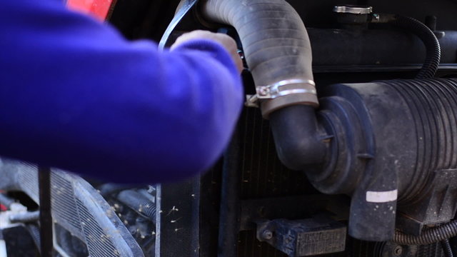 Farmer is putting pushcart engine air filter