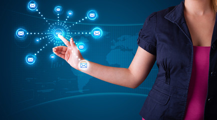 Woman pressing virtual messaging type of icons