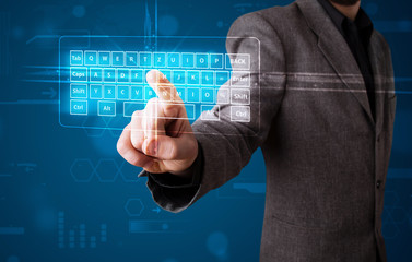 Businessman pressing virtual type of keyboard