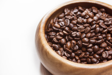 Heap of Roasted Aromatic Coffee Beans Placed in Wooden Bowl over