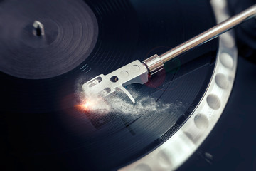 vinyl laying on a record player - scratching the surface