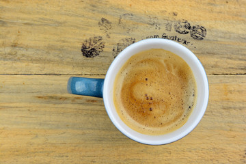 Coffe mug on old wood with text