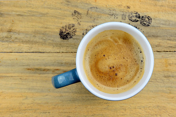 Coffe mug on old wood with text