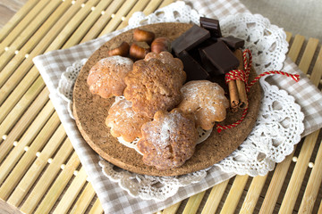 Cookies with chocolate on a wooden plate