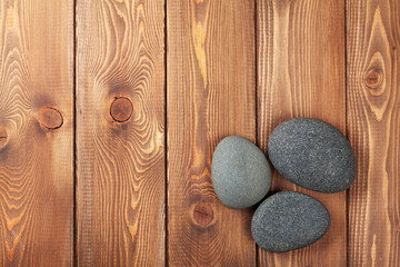 Wooden background with sea stones