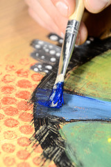 Obraz premium Painting a picture of saturated colors with acrylic paints