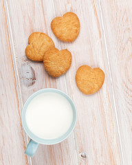 Cup of milk and heart shaped cookies