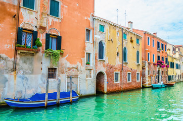 Fototapeta na wymiar Scenic canal with boats, Venice, Italy