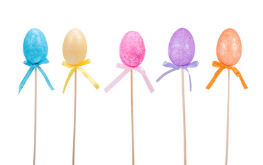 Fototapeta na wymiar Glitter Eggs on Sticks with Bows - Isolated