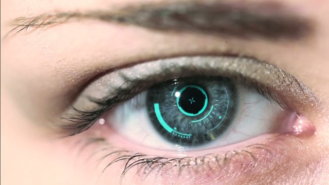 Close-up of woman's eye. New technologies and futuristic concept