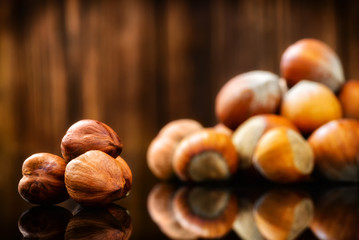 Raw Organic Whole Hazelnuts on wooden background. Selective