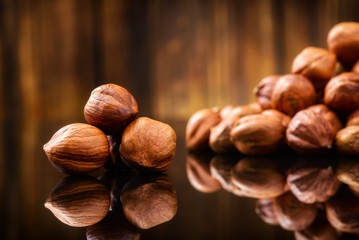 Hazelnuts, filbert on wooden background. Selective focus