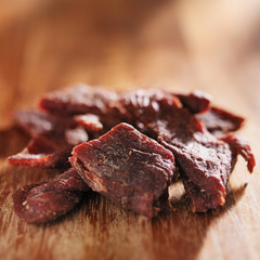 pile of beef jerky on wooden table