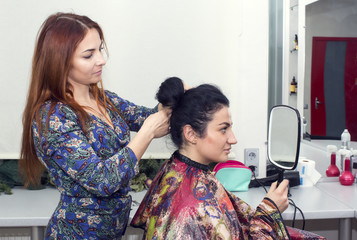 woman in a beauty salon doing hair