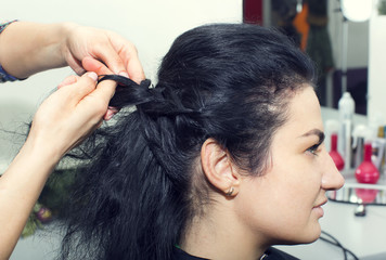 Fototapeta premium woman in a beauty salon doing hair