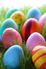 Fototapeta na wymiar Many Colorful Easter Eggs On Green Grass