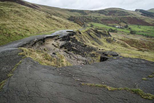 Landscape of collapsed A625 road in Peak District UK