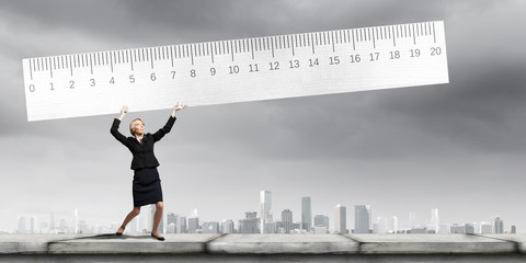 Woman with huge ruler