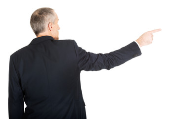 Businessman pointing to the right