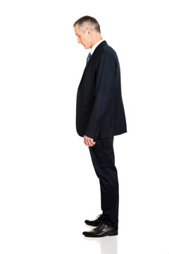Full length side view businessman standing