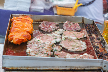 Cooking pork steak in local market Thailand.