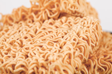 A block of dried Instant noodles on gray background paper