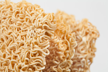 A block of dried Instant noodles on gray background paper