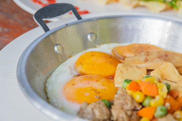 Breakfast: Fried egg add sausage, pork, string bean, corn and ca